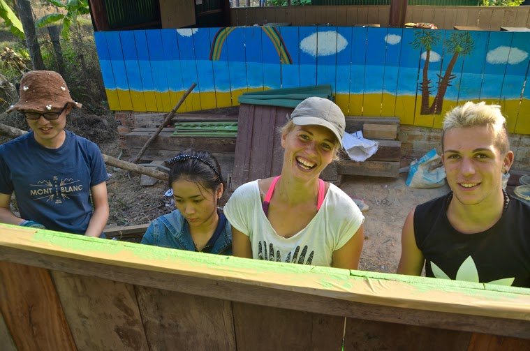 happy volunteers in cambodia doing construction work happy volunteers in cambodia doing construction work