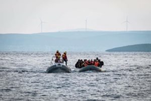 refugee boat arrival volunteering greece