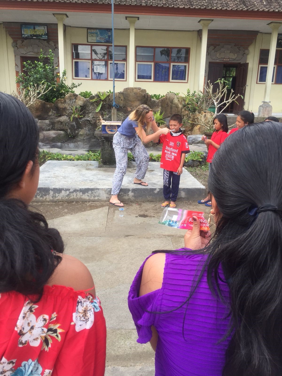 brushing teeth with the kids - Nutrition & Public Health Outreach Bali