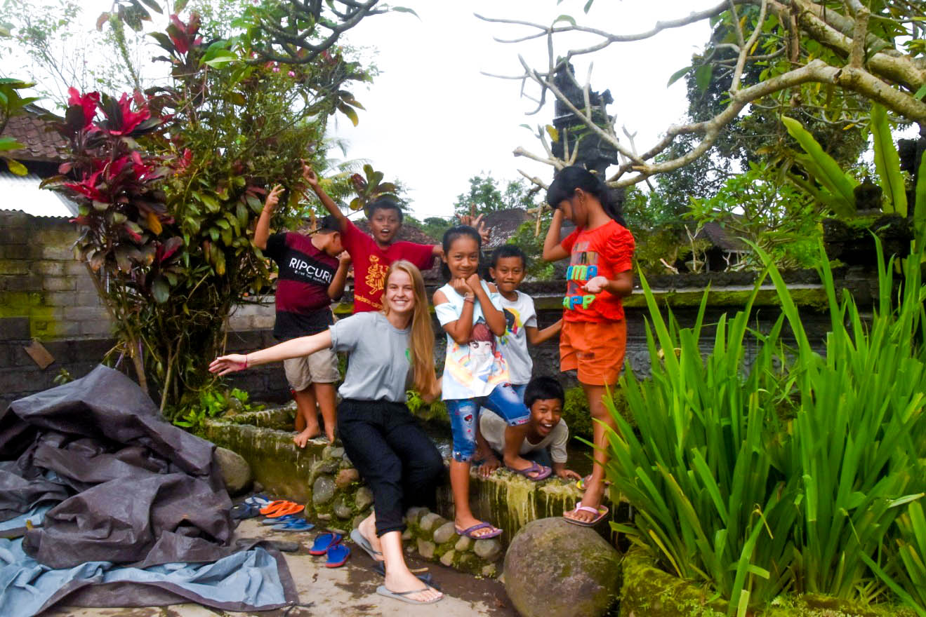 primary school students with bali volunteer teacher - Clean up Bali Program