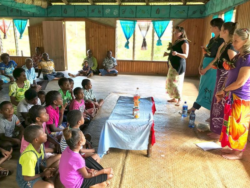 IVI volunteers teaching fijian children about sugar and diet