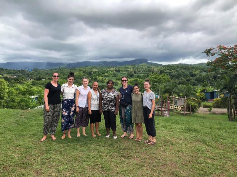 IVI volunteers in vanuatu with nice countryside in background - Copy