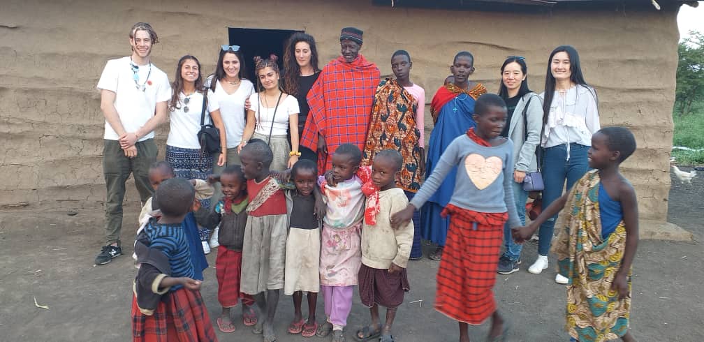 Group photo with maasai people - Reasons Why You Should Volunteer in Africa in 2023 & 2024