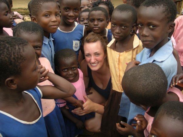volunteer surrounded by children in Ghana volunteer surrounded by children in Ghana
