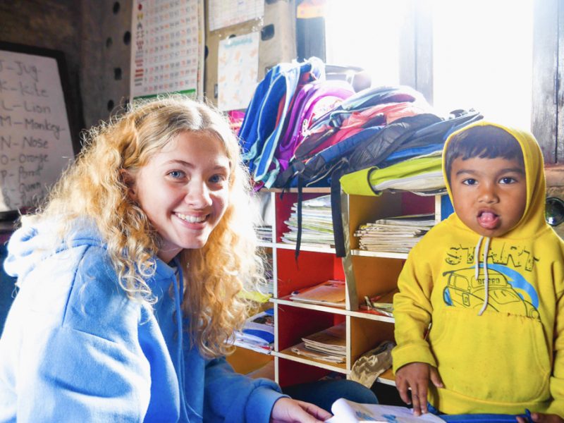 IVI volunteer with young child in Nepal 800x600 - 28 Day Nepal Road Trip