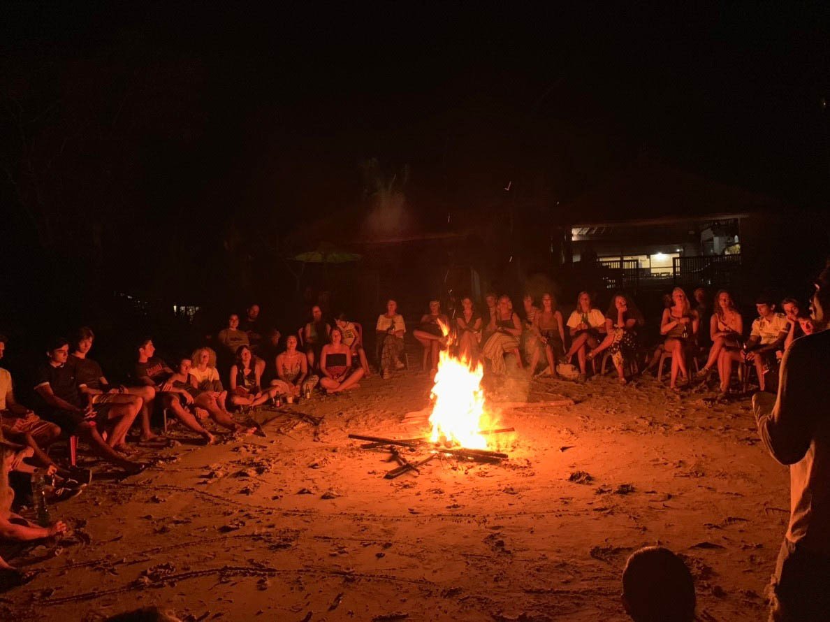 big group sitting around a bonfire 1 - Review of Bali Turtle Conservation Project