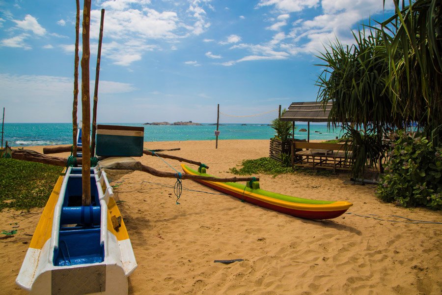 boat on beach next to turtle centre boat on beach next to turtle centre