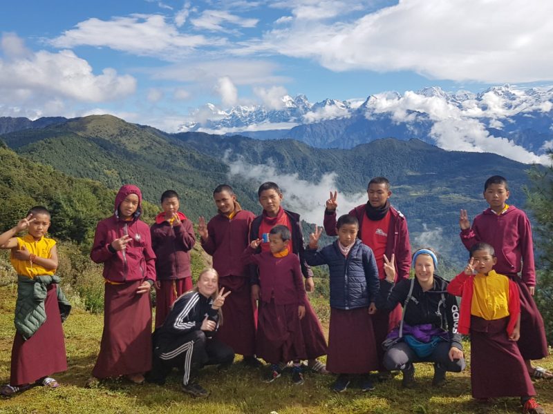 group of monks with mountain backdrop 800x600 - Nepal