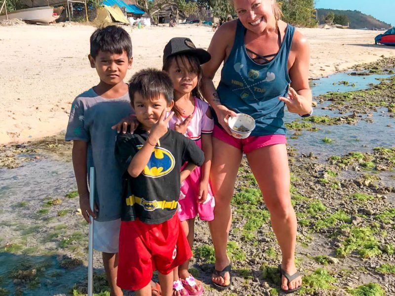 Bali posing with local children at the beach 1 800x600 - Bali