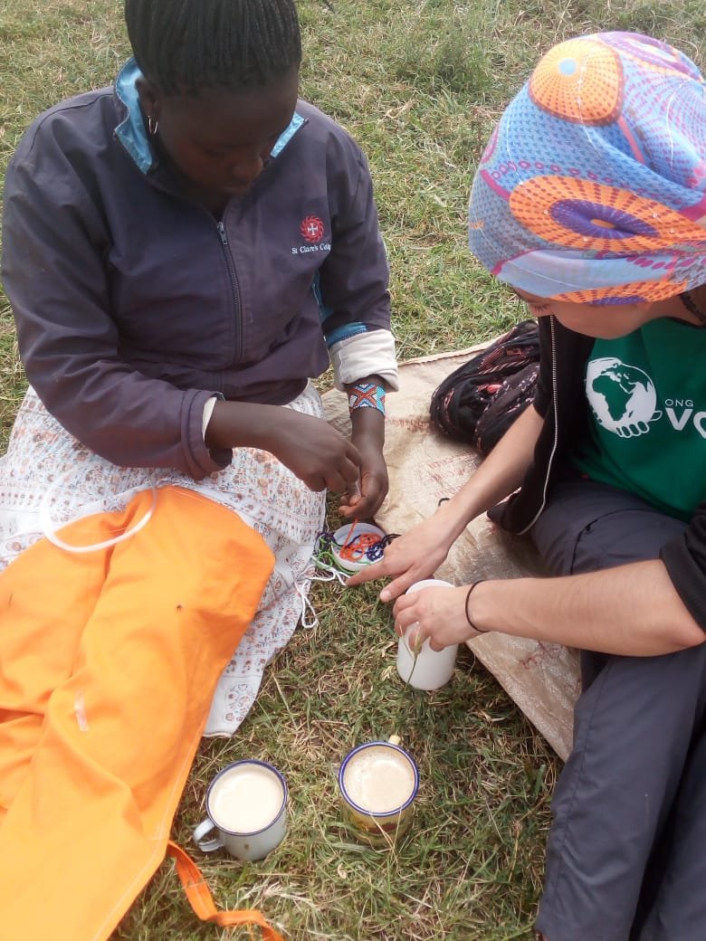 Making bracelet 2 - Reasons Why You Should Volunteer in Africa in 2023 & 2024