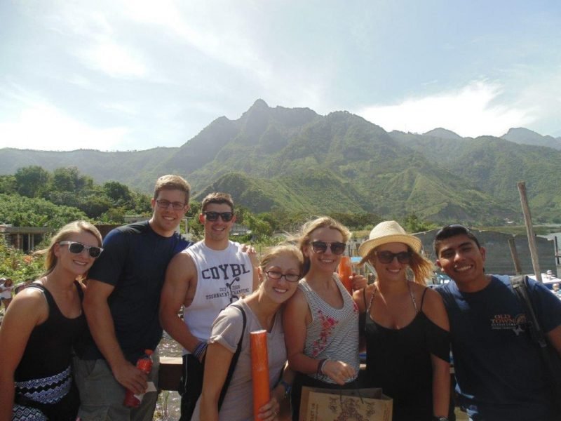 group with mountains behind group with mountains behind