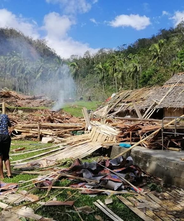 woman walking in rubble