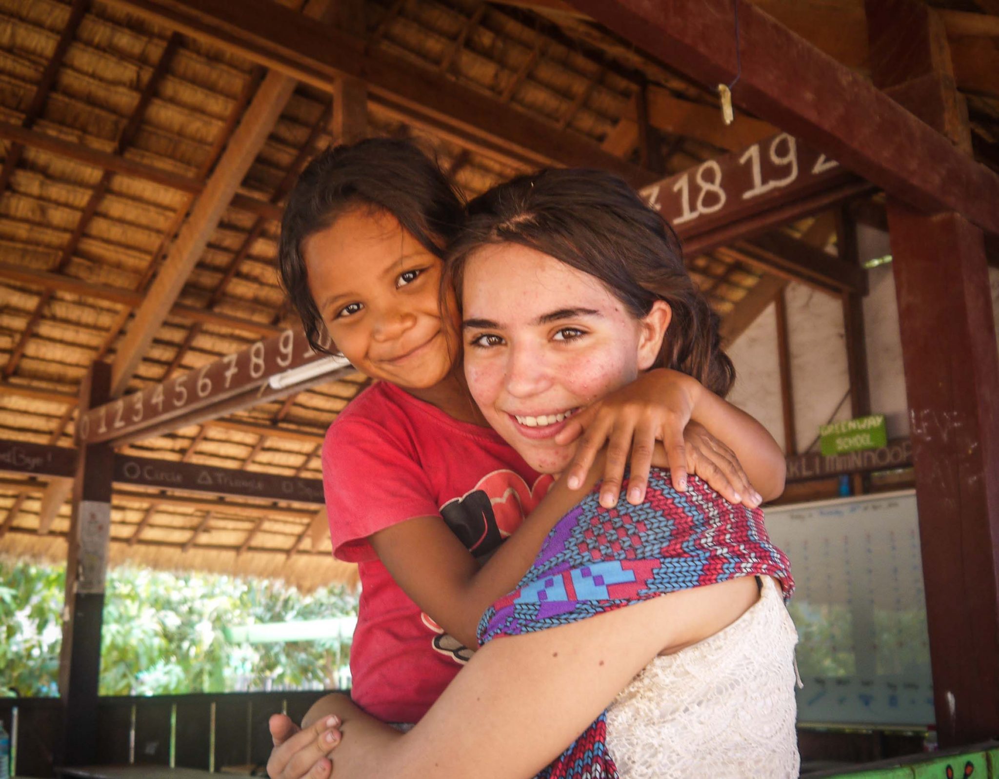 Participant and student hugging 1 scaled - Best Gap Year Volunteer Programs for Solo Travellers