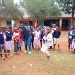 Participants and coordinator entertaining the agent 150x150 - Teaching in Kenya!
