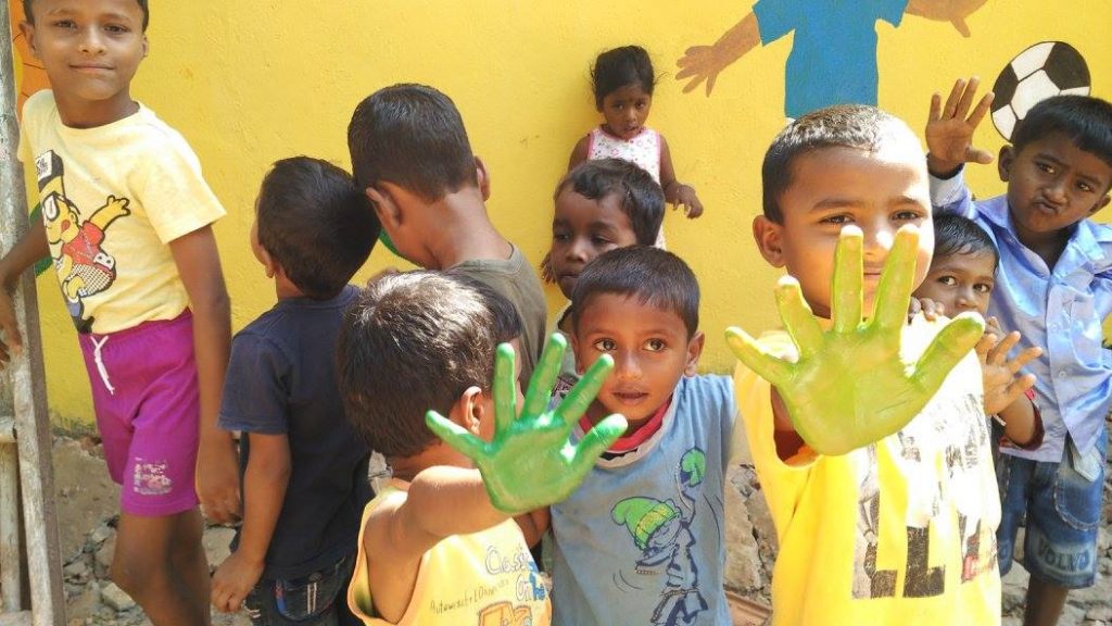 kids with paint on hands
