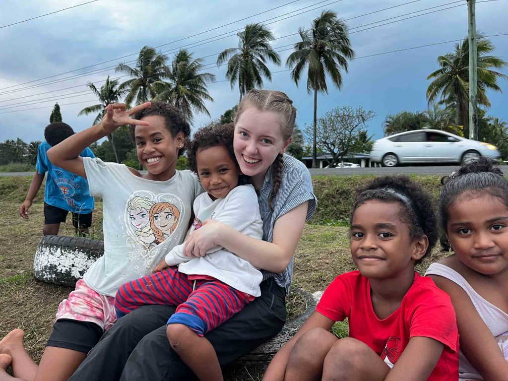 sitting with the kids in Fiji 1024x768 - Women & Children's Commune Review - Fiji