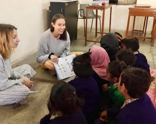 volunteers reading books to children in nepal volunteers reading books to children in nepal