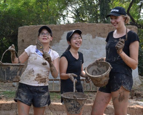 Group photo with mud buckets