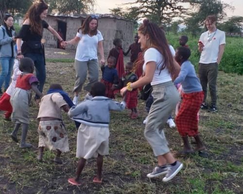Participants playing with maasai children Participants playing with maasai children