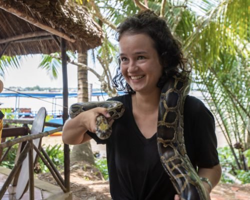 Mekong Delta Home Stay Experience Vietnam Tourist holding the pyton ojxfyr2pu3mw8oxctb5q39ms2nv3hs15tsh6vuv1r4 - Mekong Delta Home Stay Experience Vietnam