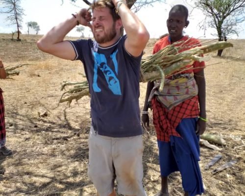 IVI volunteer carrying firewood IVI volunteer carrying firewood