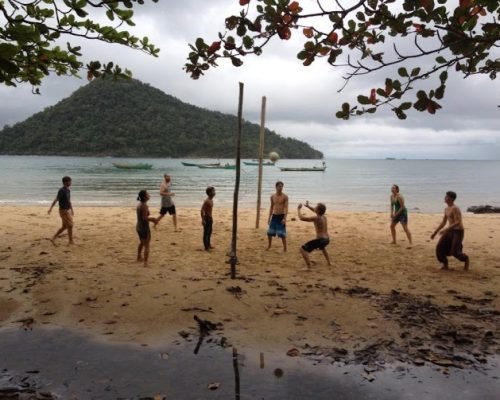 playing volleyball at the beach with new friends playing volleyball at the beach with new friends