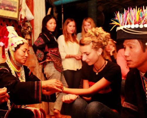 volunteers receiving bracelets as a gesture of goodwill volunteers receiving bracelets as a gesture of goodwill