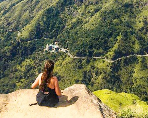 sitting on a rock overlooking green countryside oj929vhne3w56r5jdvw4d4nuyiumbbmanrnm3dv89s - Hill Country Adventure Trek Sri Lanka