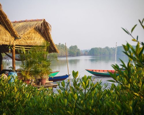 straw huts by river in Cambodia straw huts by river in Cambodia